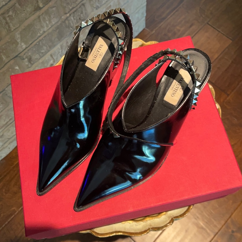 Valentino black patent leather booties with rock-stud ankle straps.